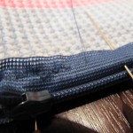 Sewing The Zipper To A Crochet Pouch